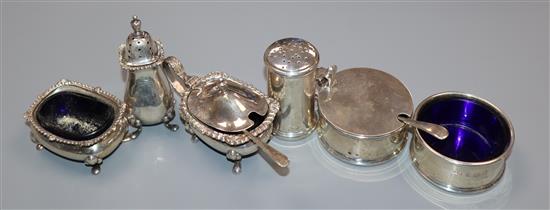 A George VI silver three piece condiment set, London 1945 and three other silver condiments.